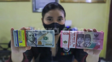 Rupiah Anjlok Terhadap Dolar AS pada Pagi Ini