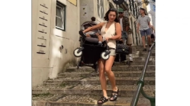 Jennifer Bachdim Santai Angkat dan Dorong Stroller Anak di Portugal, Tetap Stylish Meski sedang Ribet