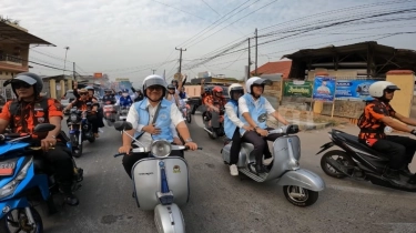 Dikawal Ribuaan Pendukung, Helldy-Alawi Daftar ke KPU Naik Vespa: InsyaAllah Dua Periode