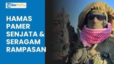 VIDEO Hamas Pamer Senjata dan Seragam 'Rampasan' di Hadapan Militer Israel saat Bebaskan Sandera